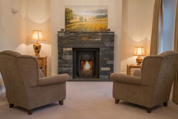 Slate fireplace with open fire